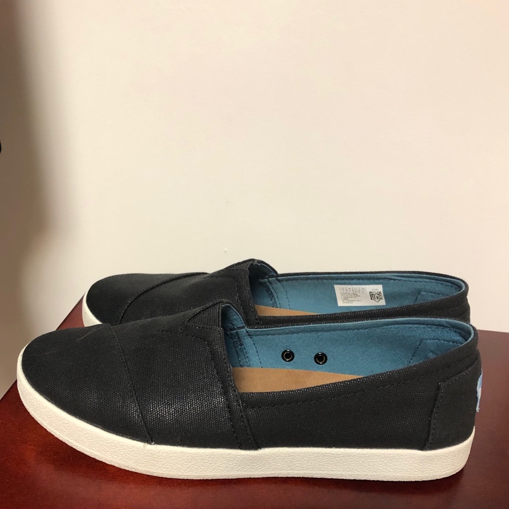 Tom’s slip ons.